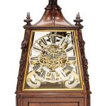 A very fine exhibition quality large triple fusee quarter chiming musical skeleton clock in carved walnut vitrine
