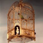 Gilt-metal clock in form of bird-cage