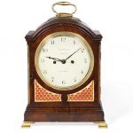 A early 19th century brass mounted mahogany table clock