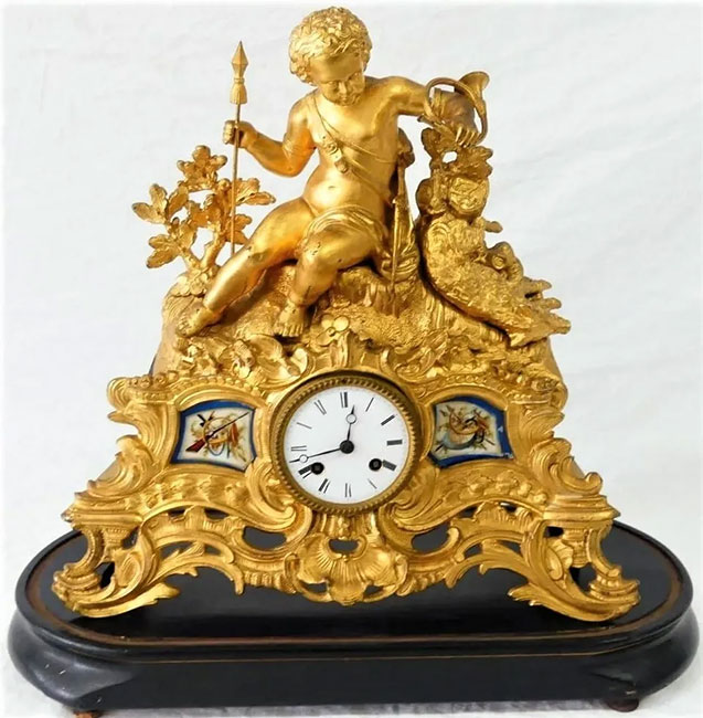 Gilt metal clock with putti